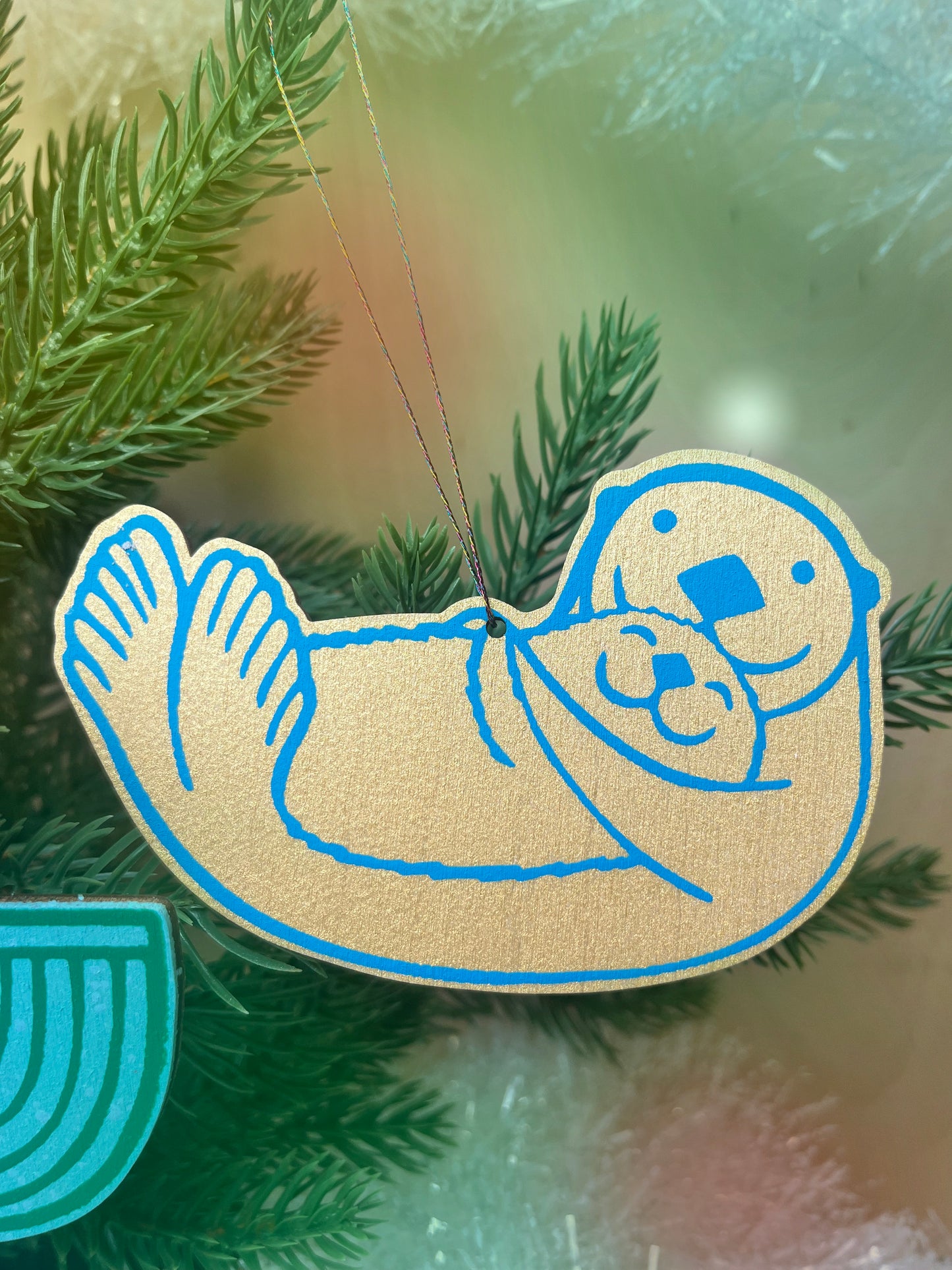 Printed “Otter Cuddles” wooden cut-out ornaments