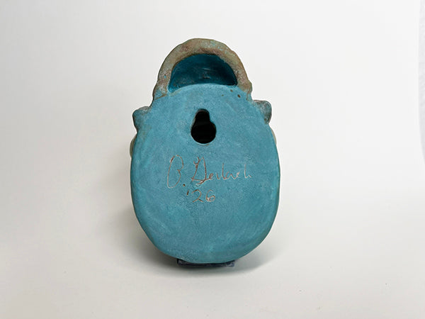 Gus fish-head wall-hanging with tan beanie and mustache