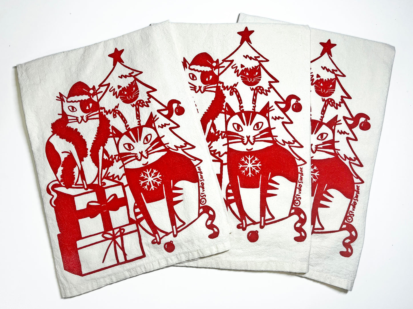Festive Felines hand-printed tea towel in merry red