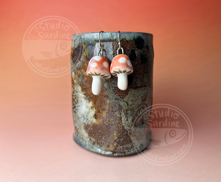 Hand-sculpted porcelain toadstool mushroom earrings in pink