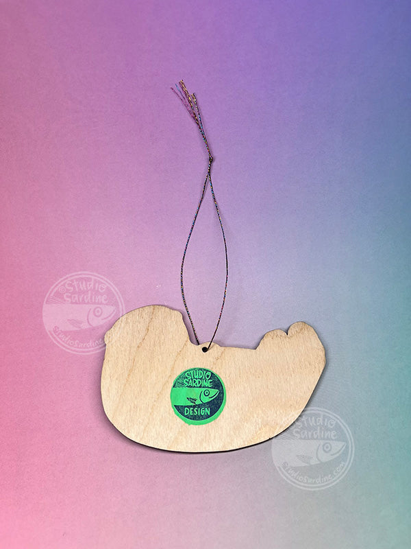 Studio Sardine Printed “Otter Cuddles” wooden cut-out ornaments