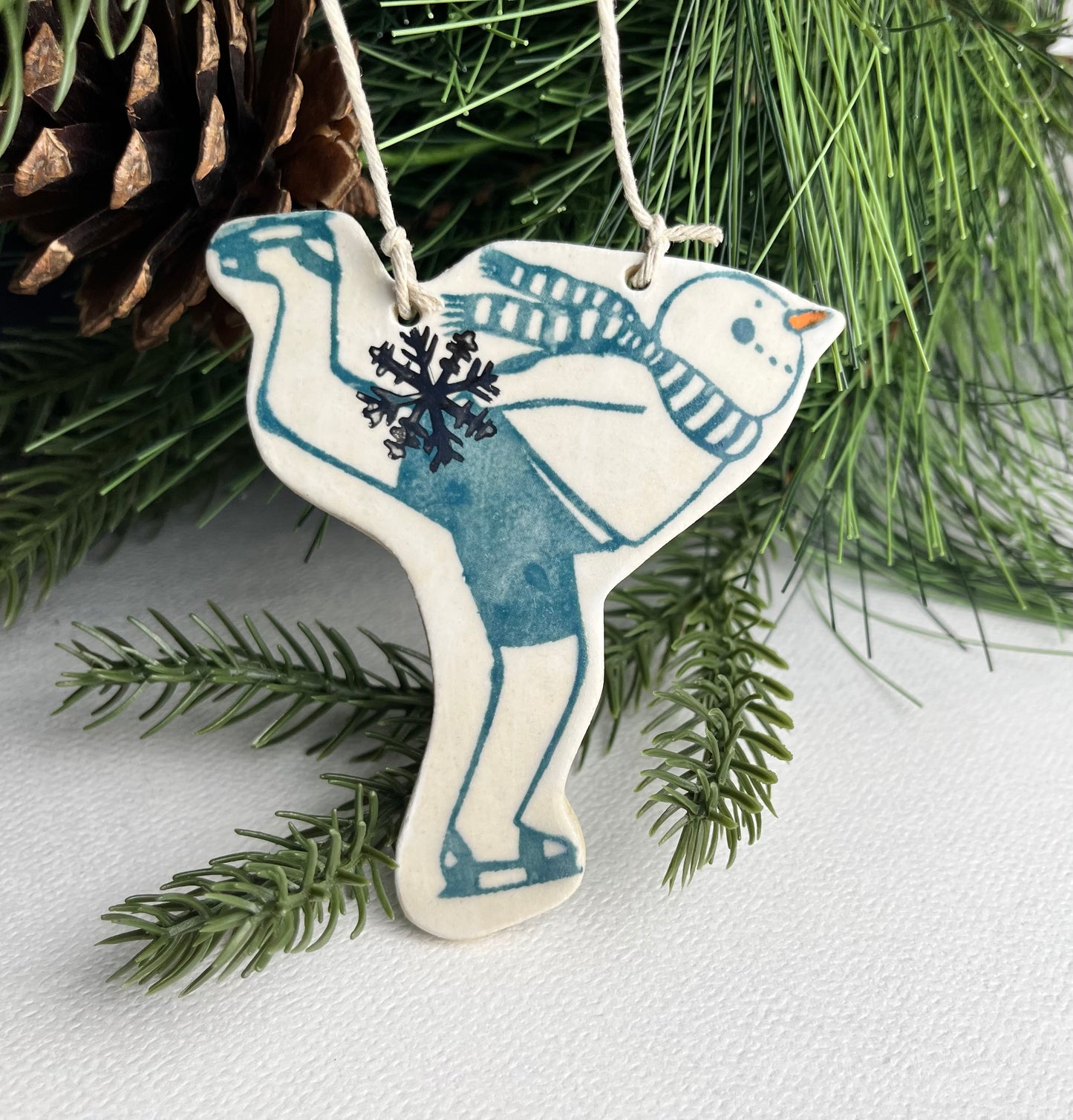 Skating Snowman stoneware ornament