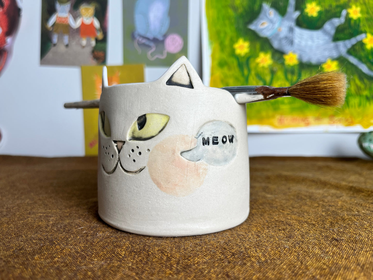 Mischievous cat watercolor brush cup