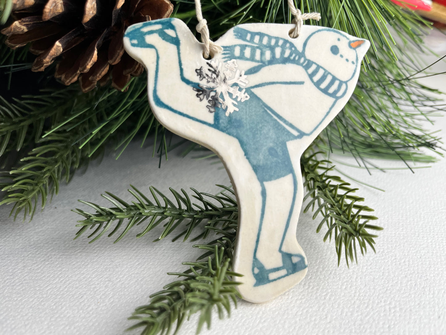 Skating Snowman stoneware ornament