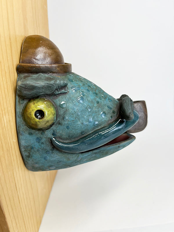 Herbert fish-head wall-hanging with bowler hat and pipe
