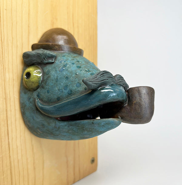 Herbert fish-head wall-hanging with bowler hat and pipe
