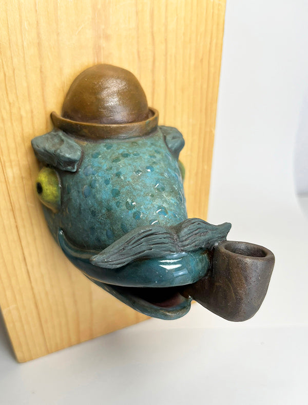 Herbert fish-head wall-hanging with bowler hat and pipe