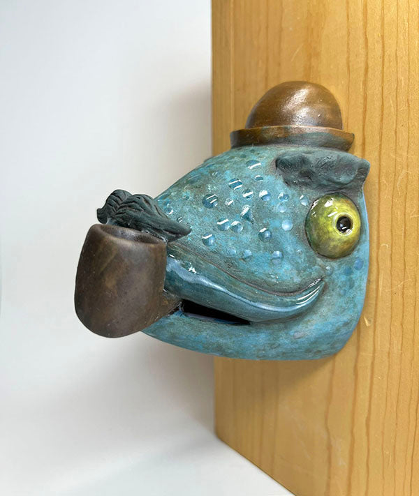 Herbert fish-head wall-hanging with bowler hat and pipe