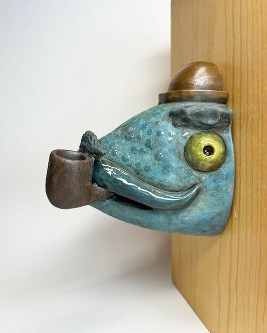 Fish-head wall-hanging with bowler hat and pipe