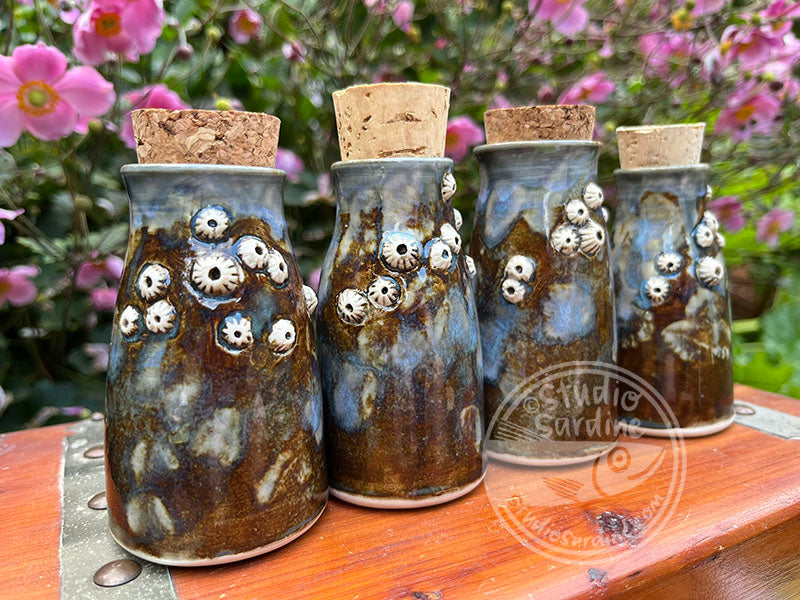 Tiny porcelain barnacle bud vase
