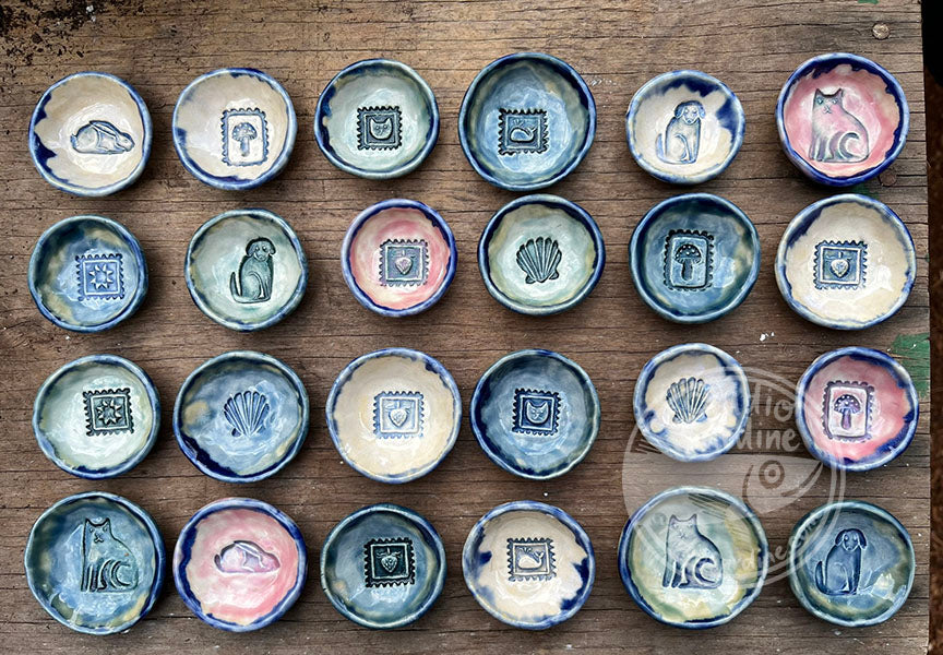 Tiny stamped ceramic pill dishes