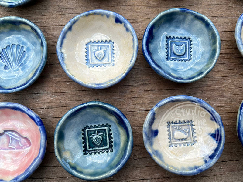 Tiny stamped ceramic pill dishes