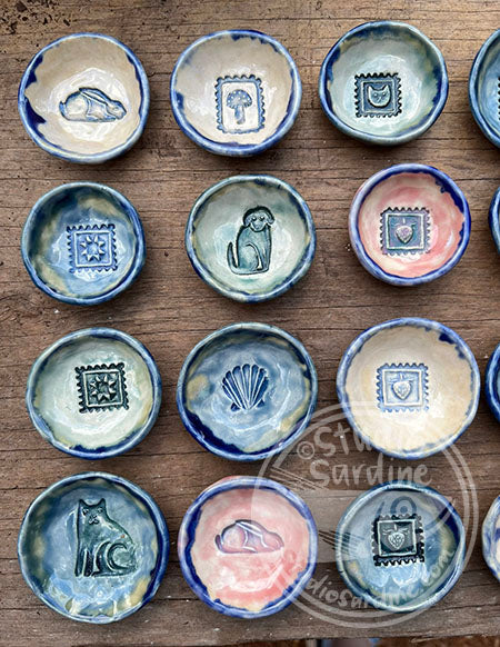 Tiny stamped ceramic pill dishes