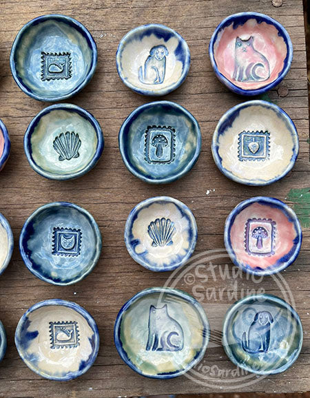 Tiny stamped ceramic pill dishes