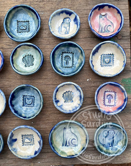 Tiny stamped ceramic pill dishes