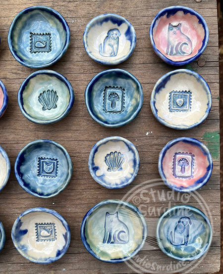 Tiny stamped ceramic pill dishes