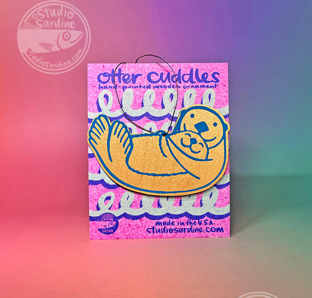 Printed “Otter Cuddles” wooden cut-out ornaments