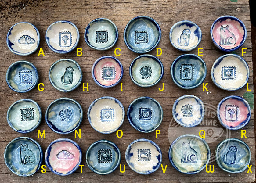 Tiny stamped ceramic pill dishes