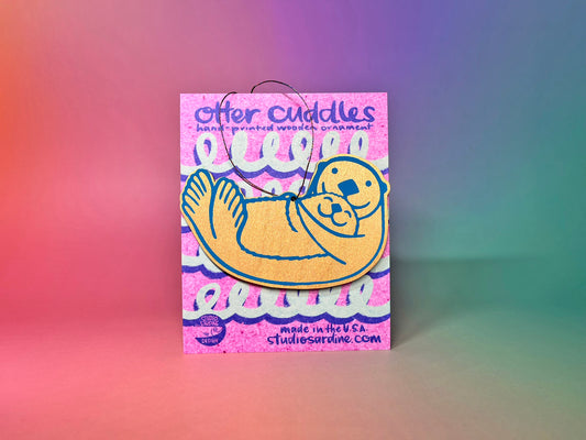 Printed “Otter Cuddles” wooden cut-out ornaments