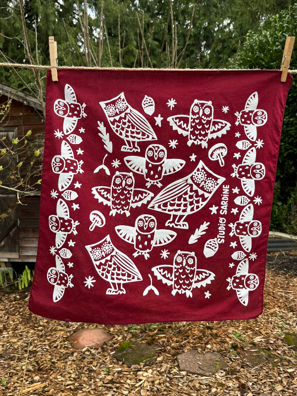 Ceramic owl bandana screenprinted in white on maroon- skewed bandanas