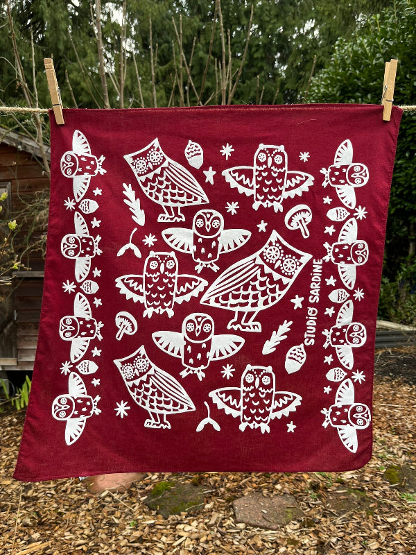 Ceramic owl bandana screenprinted in white on maroon- skewed bandanas