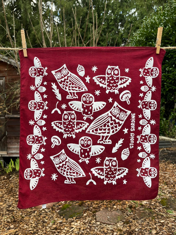 Ceramic owl bandana screenprinted in white on maroon- skewed bandanas